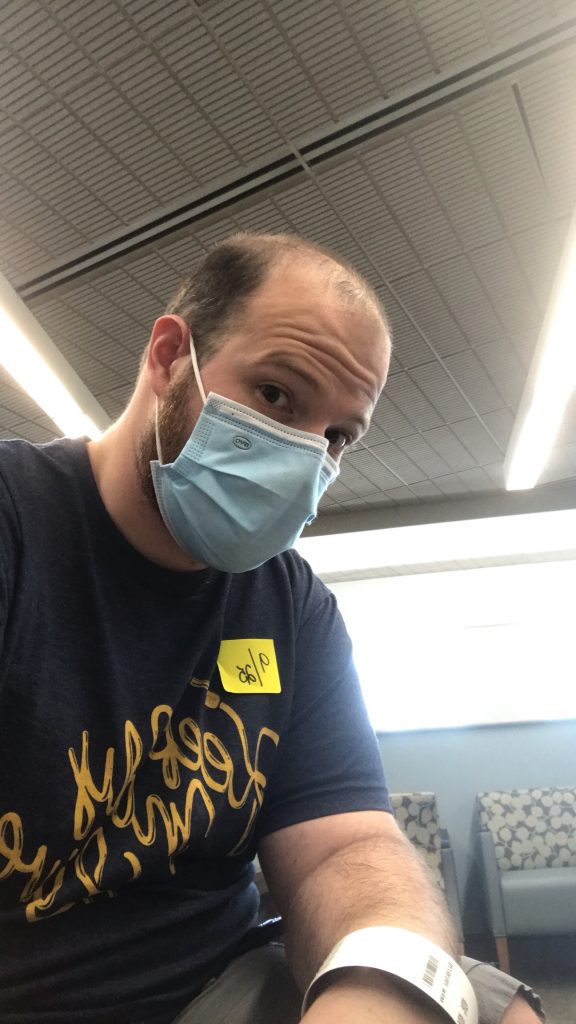 Matt in a mask at a doctor appointment